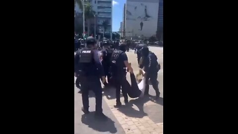 Police pull and drag protesters out of the streets
