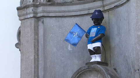 Statue of Manneken Pis is dressed up in his NATO costume .... PISS ON NATO!!!!