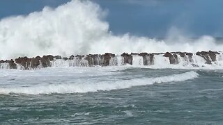 Wind surges, ocean wind waves, and swell at Shark’s Cove at Pūpūkea Beach Park, Oahu Hawaii.