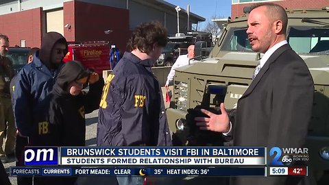 Baltimore FBI agents trade badges for gifts with special needs high school students