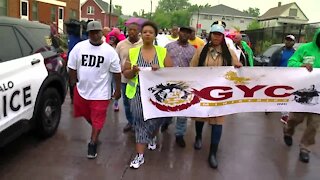 Community and police rally against gun violence together after violent weekend
