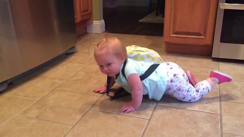 Cute Tot Girl With Heavy Backpack Struggles To Stand Up