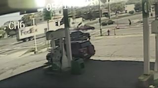 Surveillance video shows truck slam into van