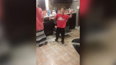 Boy Falls On Open Dishwasher While Singing And Dancing