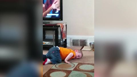 Funny Boy Slides Over The Floor To His Mom