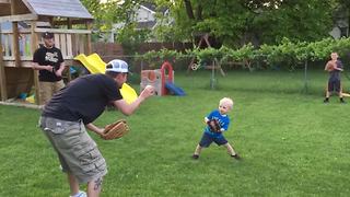 A Tot Boy Struggles To Balance As He Plays Catch With His Uncle