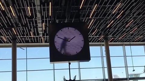 Clock in the Amsterdam Airport This artist spends 12 hours in a giant clock to paint every minute