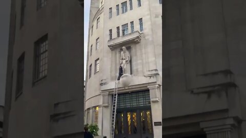 David Chick AKA Spiderman scales the BBC smashes up the Eric Gill pedo statue