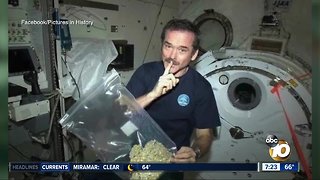 Astronaut shows off bag of pot?