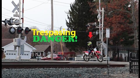 Dirt biker trespassing on railroad tracks