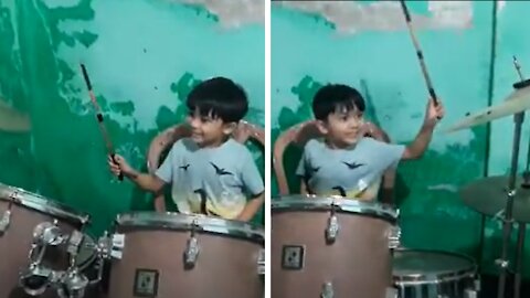 2 year old baby playing drums