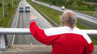 This Man Has Spent 48 Years Waving To Cars From A Highway Overpass