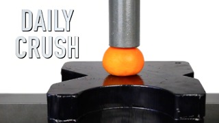 Crushing an orange with a hydraulic press!