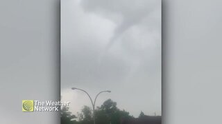 Small funnel forms in the sky on a rainy day