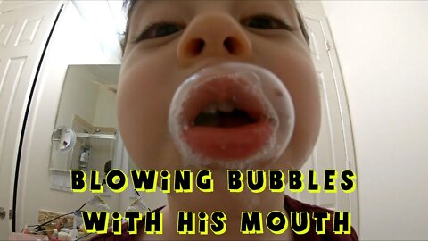 Little Boy Blowing Giant Mouth Bubbles