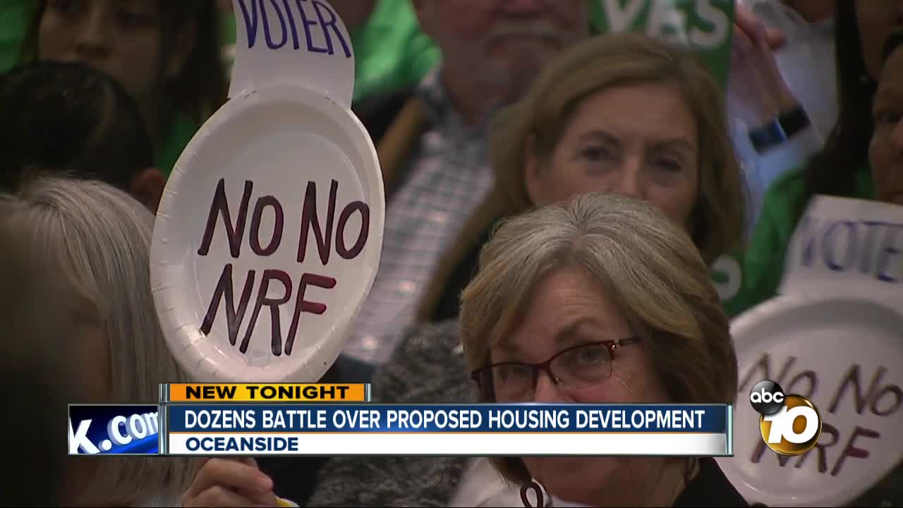 Dozens battle over proposed housing development