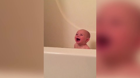 Adorable Baby Boy Enjoys Bath Time