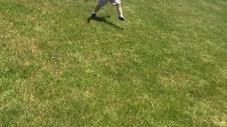 Toddler Boy Tumbles Down Grassy Hill