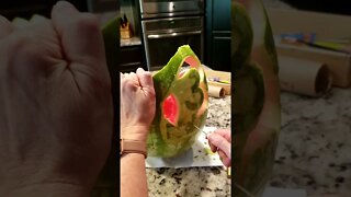 Carving Dinosaurs on a watermelon