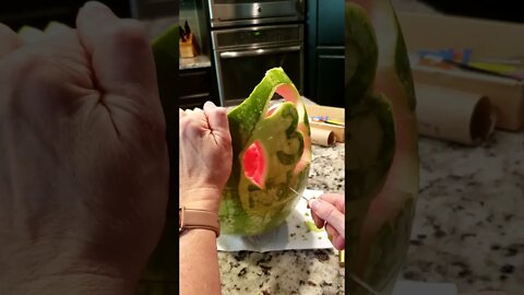 Carving Dinosaurs on a watermelon