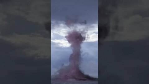 small tornado in the middle of the ocean