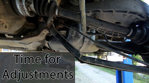 Replace and adjust right rear lower arm