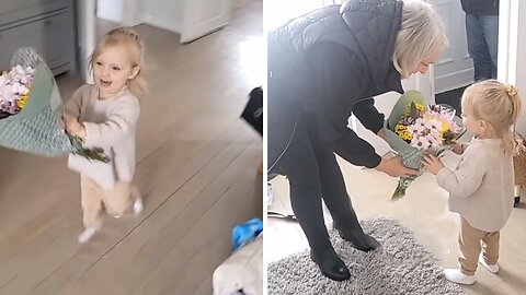 Toddler Excitedly Gives Grandma Flowers For Mother's Day