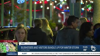 Downtown busy with locals and visitors bundled up for winter storm