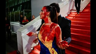 Cannes Protester in Ukrainian Colors Covers Herself with Fake Blood on Red Carpet