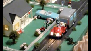 Santa Drives a VW in a Christmas Village