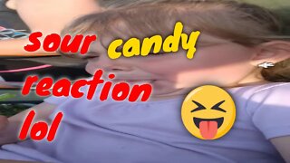 little girls reaction to a sour candy