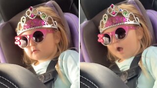 Baby caught singing song in the back seat
