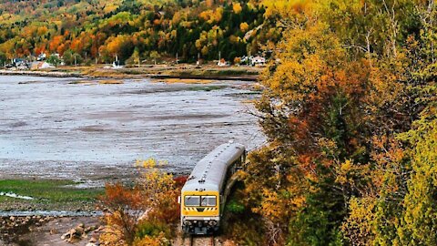 This Quebec Train Takes You On A Riverside Ride Though A Cliff & Past Stunning Fall Views