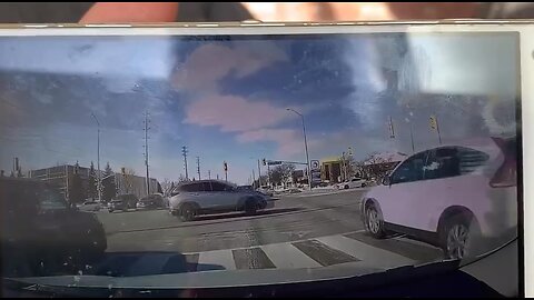 Distracted Driver Runs Red Light