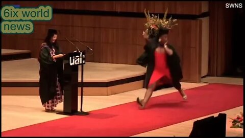 student does the SPLITS during graduation entrance
