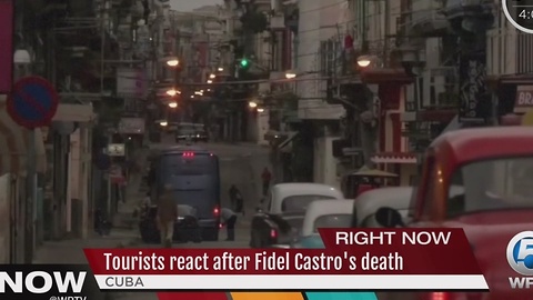 Tourists react after Fidel Castro's death
