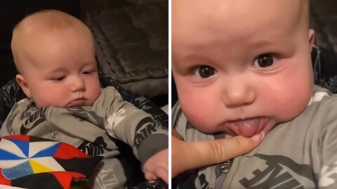 Baby Adorably Blocks Mommy From Showing His Teeth