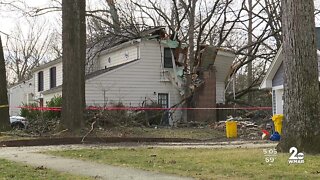 Woman killed after tree falls onto house in Crofton