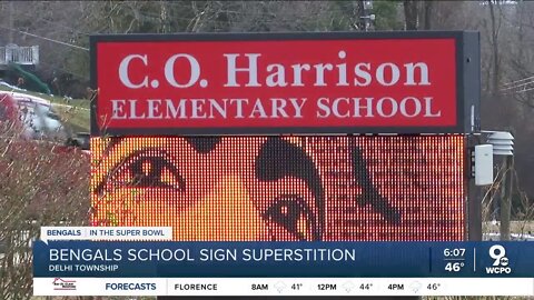 What is the superstition behind the 'Who Dey' sign at C.O. Harrison Elementary School?