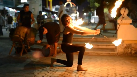 Street performer shows off stunning fire dance