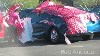 "Gift wrapping cars" prank has emotional twist