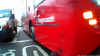 Bus runs read light, misses bike by mere inches