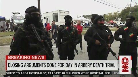 Black Armed protesters outside murder trial for a black man (Ahmaud Arbery)