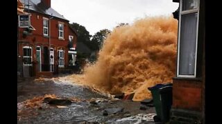 Pipes burst and flood street in the UK