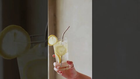 Close-Up Video of a Person Holding a Glass of Water with Lemon#short #amazingworld