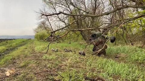 Ukrainian troops launch a Javelin missile and are immediately fired upon by Russian forces