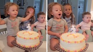 Toddler Tries To Blow Out Birthday Candle After Dad Blocks It Twice