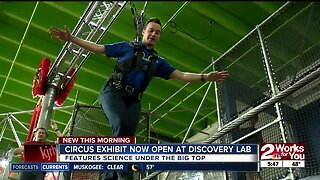 Travis tries out Discovery Lab's new hands-on circus exhibit