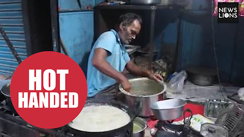 Street vendor is able to dip his bare hands into boiling hot OIL without injury