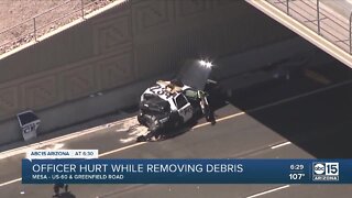 Officer hurt after removing debris on US60